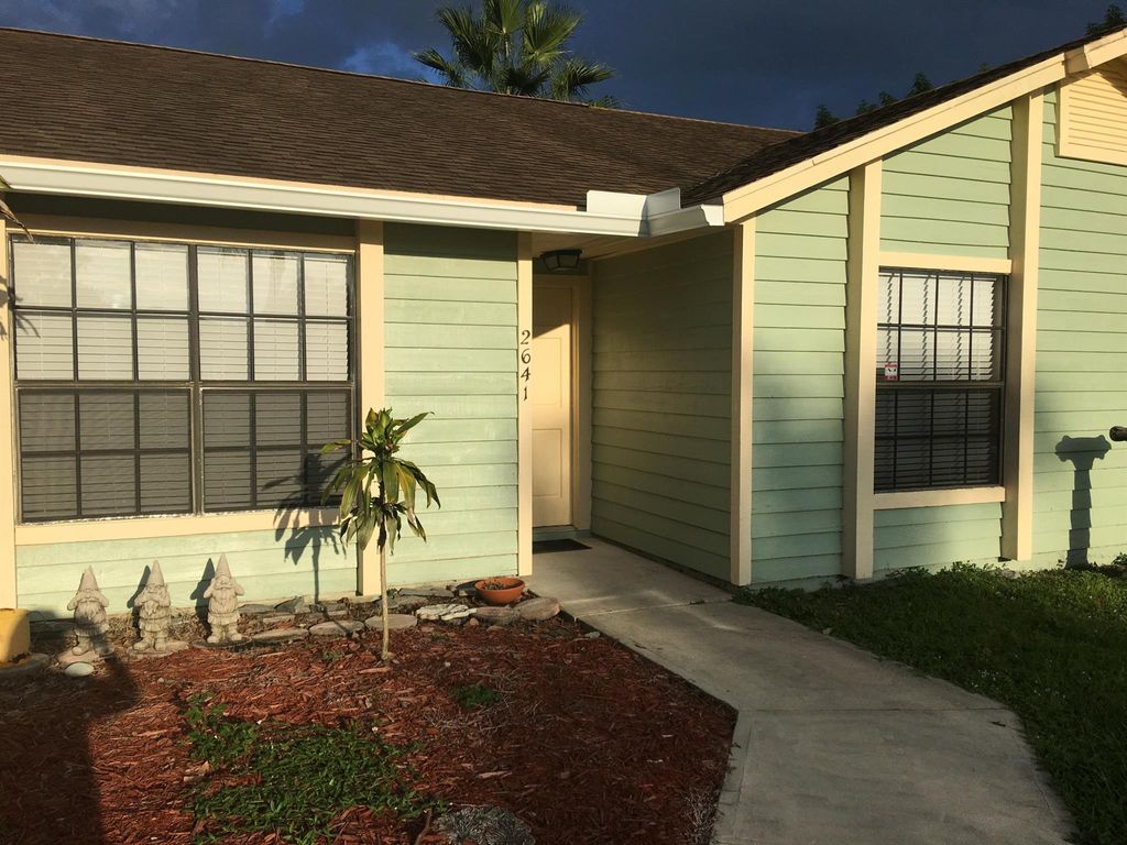Photo of 2641 SW Eastman Street, Port Saint Lucie, FL 34953 (MLS # R11000732)