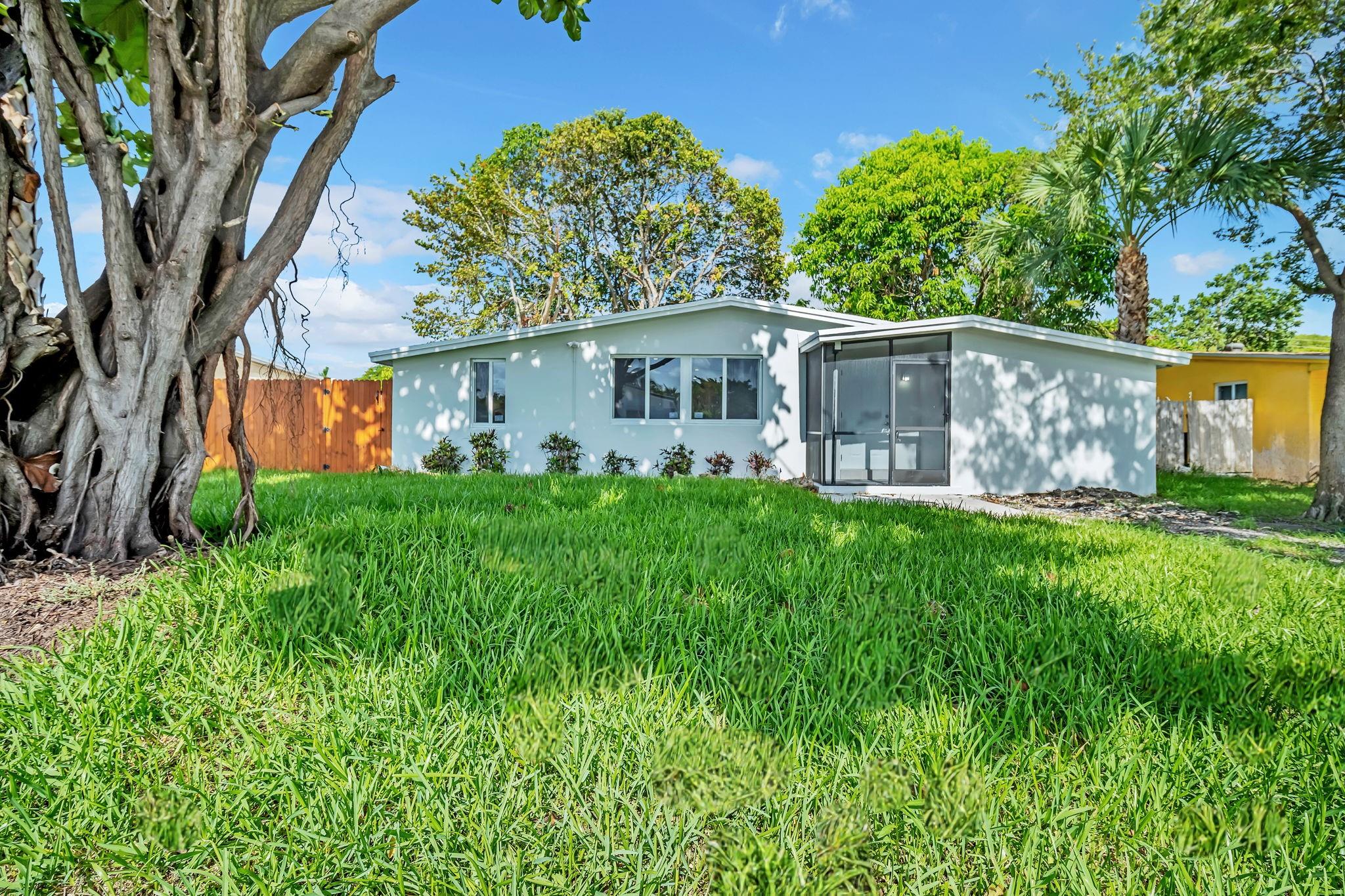 Beautifully renovated 3-bedroom, 1-bath single-family home with high-end finishes and modern charm. This home features a brand-new roof, new A/C, and new impact windows – all completed with permits. The bright open layout showcases large format tile flooring, a fully updated kitchen with white shaker cabinets, quartz countertops, and stainless steel appliances. The bathroom has been tastefully remodeled with contemporary fixtures. Enjoy a spacious, fenced backyard with mature trees and a screened-in patio—perfect for outdoor living. Easy to show and move-in ready!
