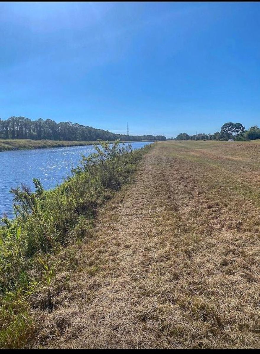 Your peaceful retreat awaits in Lakeside Shores! Imagine building your dream home on this 1/2-acre lot nestled in the quiet Lakeside Shores community. With utilities ready at the street & a cleared lot, it's an effortless start to your next chapter. Enjoy the privacy of a 1/4-acre easement while relaxing with canal views on this high & dry lot. Lakeside Shores offers just 21 homesites & an HOA fee of only $250 per year. Whether you're planning to build a cozy getaway or your forever home, this lot is the perfect blend of convenience & tranquility.