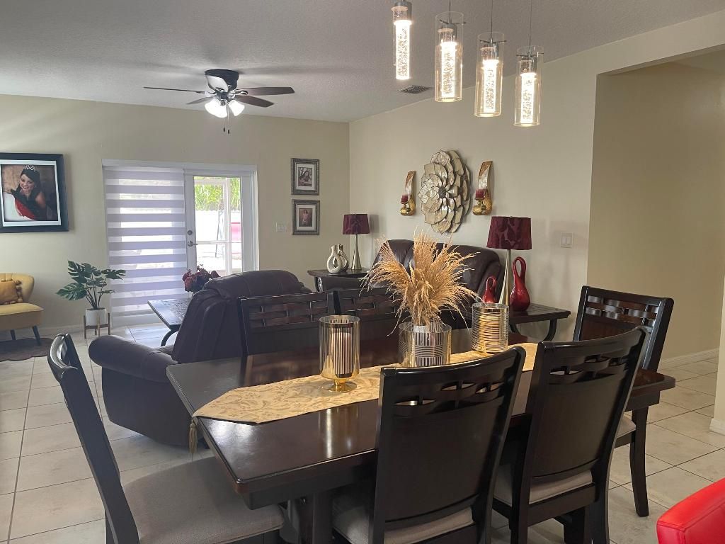 Photo of 1051 SW Longfellow Road, Port Saint Lucie, FL 34953 (MLS # R10982105)