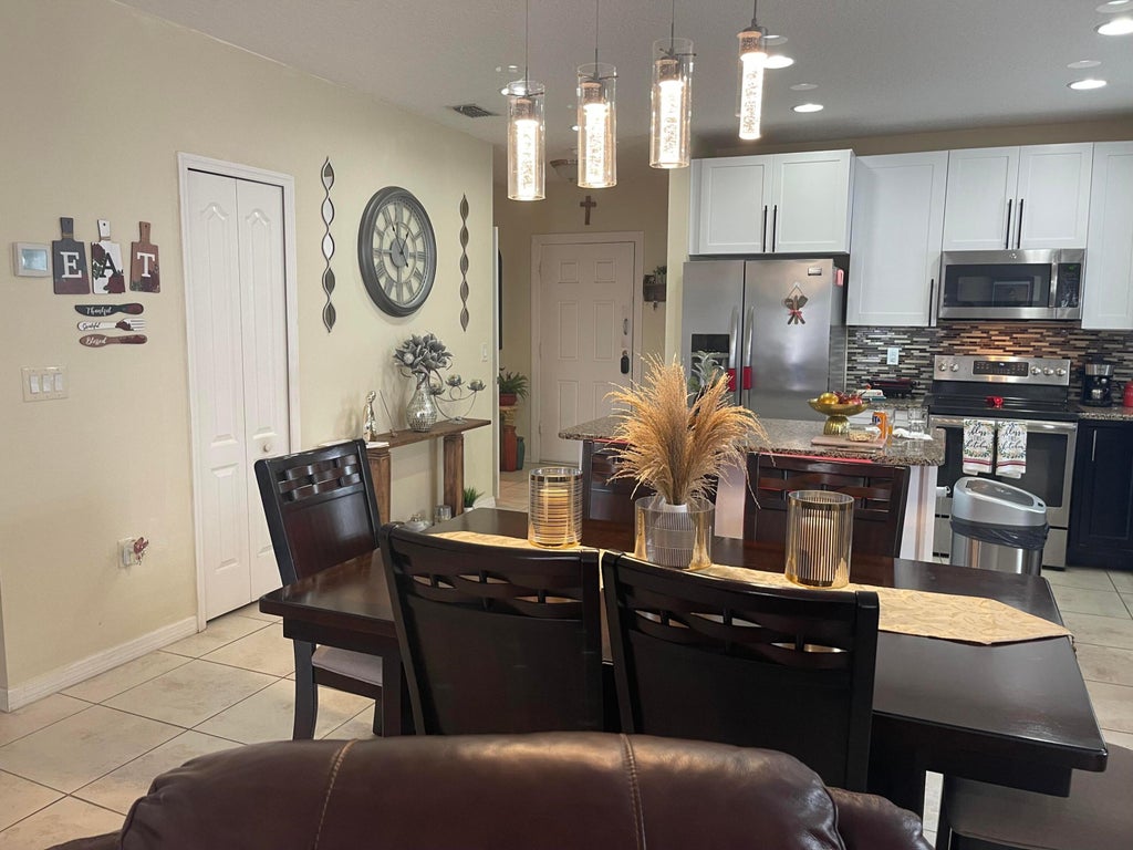 Photo of 1051 SW Longfellow Road, Port Saint Lucie, FL 34953 (MLS # R10982105)