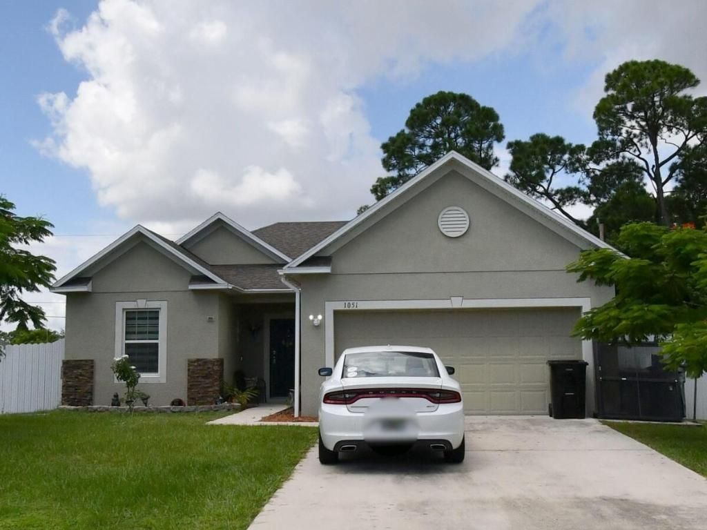 Photo of 1051 SW Longfellow Road, Port Saint Lucie, FL 34953 (MLS # R10982105)