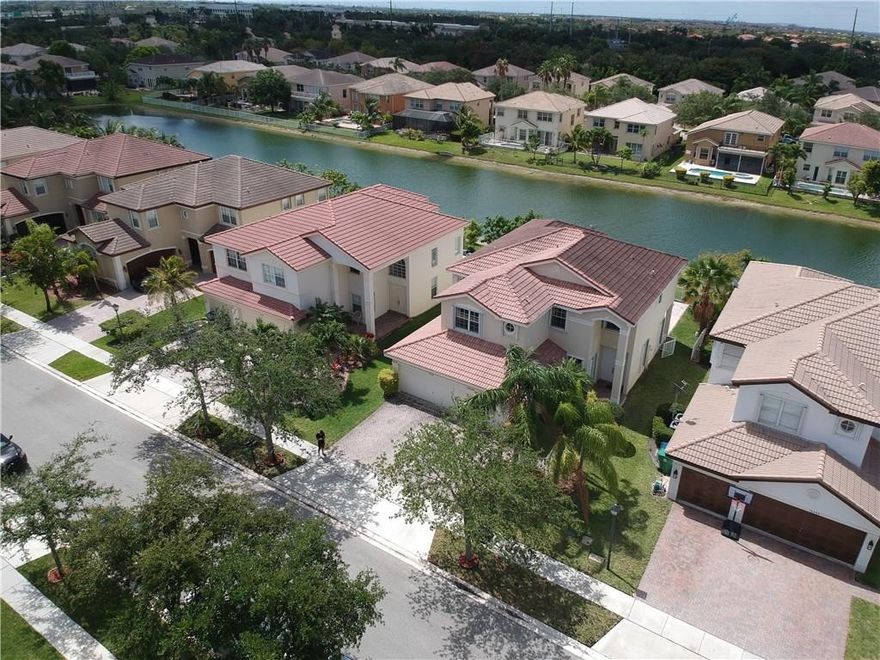 Spacious 6/4 located in the prestigious gated community of Silver Ilses. This home is filled with Natural light throughout the day.  1 bedroom and full bath located on the first floor. 5 bedrooms, including the Master on the second floor. Note: Kitchen is ready for a remodel which leaves opportunity for the buyer. Silver Isles also has a community club house equipped with Pool, Jacuzzi, and gym along with additional amenities.