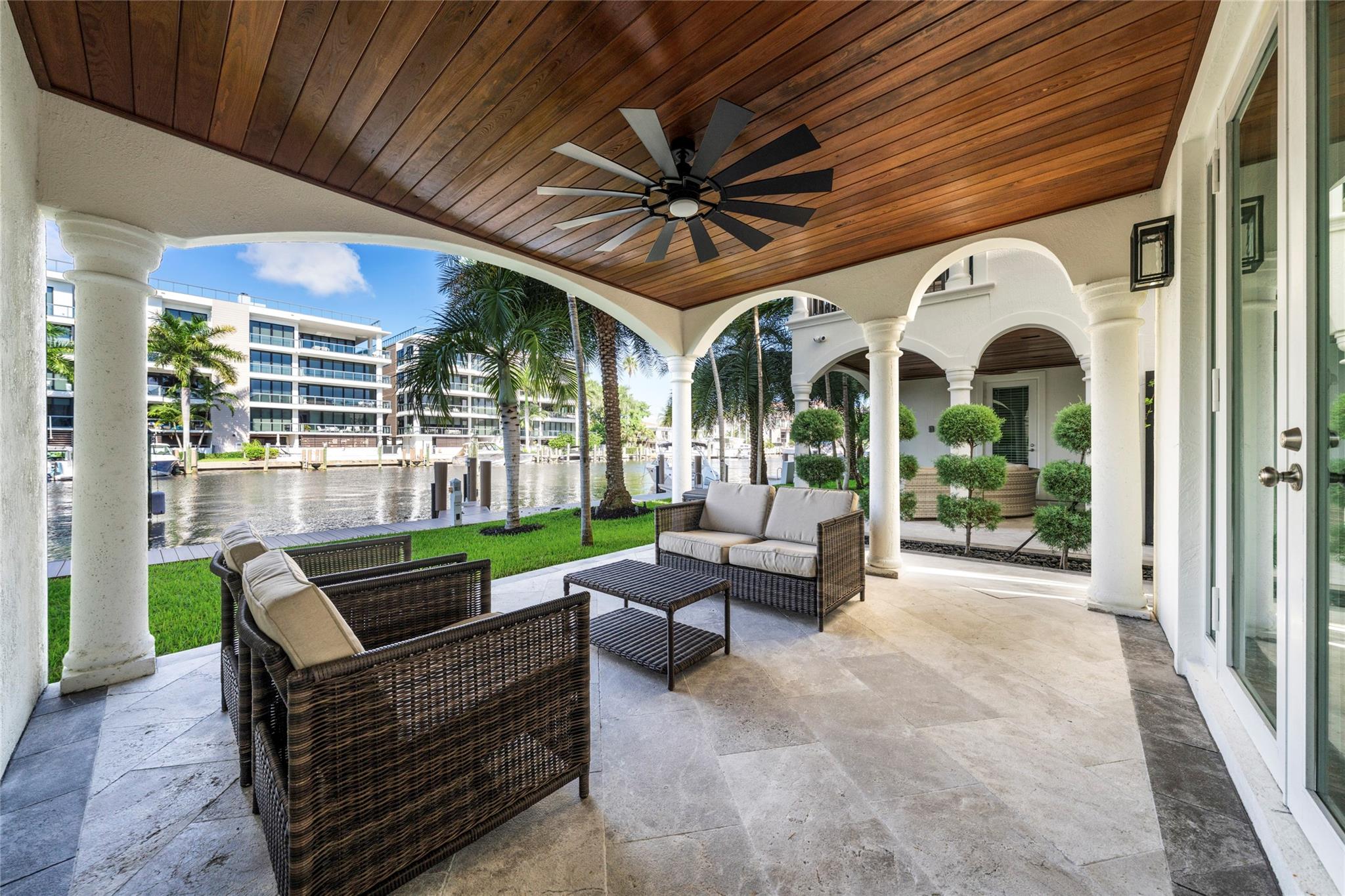 Experience luxury living in this beautifully updated corner townhome in the prestigious Las Olas Isles, complete with dockage for a boat up to 60’. Flooded with natural light, the expansive interior offers stunning water views. Highlights include a private elevator, marble floors, a modern gourmet kitchen, a loft area, and a spacious rooftop terrace with panoramic views. Enjoy two covered patios, and gated access with a two-car attached garage. Each of the four bedrooms features oversized custom closets, including the master suite with his-and-her closets. This townhome truly has it all. Excellent location at the heart of Fort Lauderdale. Steps from Las Olas where you will find world class dining, art galleries, nightlife, and more. Minutes from the beach Ft Lauderdale Int. Airport.