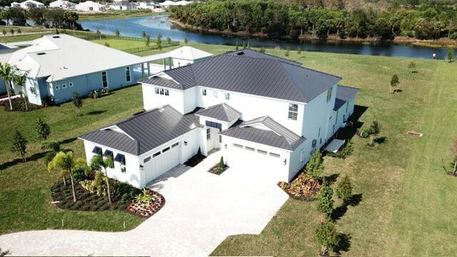 Brand new construction 6 Bedroom estate home on an acre homesite for quick move in! This stunning Livingston home is a must see. Ample room to entertain inside and out. Convenient ground floor Owner's Suite and Guest Suite plus a private Casita off the rear of the home. Upstairs offers a spacious loft overlooking the gathering room and media room making your home ready for any type of occasion or entertaining event. With over an acre of land with a water view in Jupiter, this is the place to be! Start your new year out in your new home at Bridgewater.