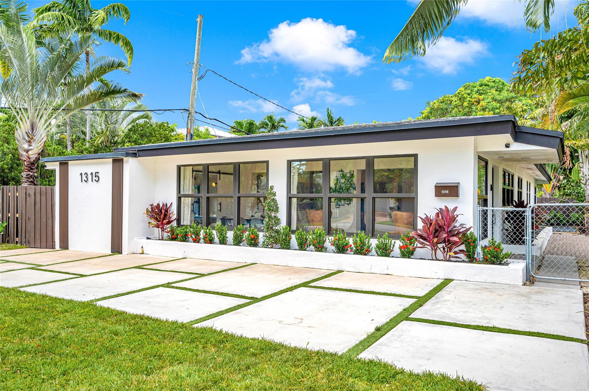 Beautifully transformed 4BR Victoria Park home with lush new landscaping, modern finishes, and light-filled living spaces. The open layout features a stunning kitchen with waterfall island, spacious baths, and two versatile bonus rooms for an office, playroom, or gym. The serene primary suite offers comfort and privacy. Step outside to a sparkling plunge pool, dining patio, and tropical yard—perfect for entertaining or relaxing. Conveniently near Holiday Park with pickleball, tennis, and recreation, and close to Las Olas dining and boutiques. Minutes to the beach and top-rated schools, this home blends style, location, and lifestyle in the heart of Fort Lauderdale.