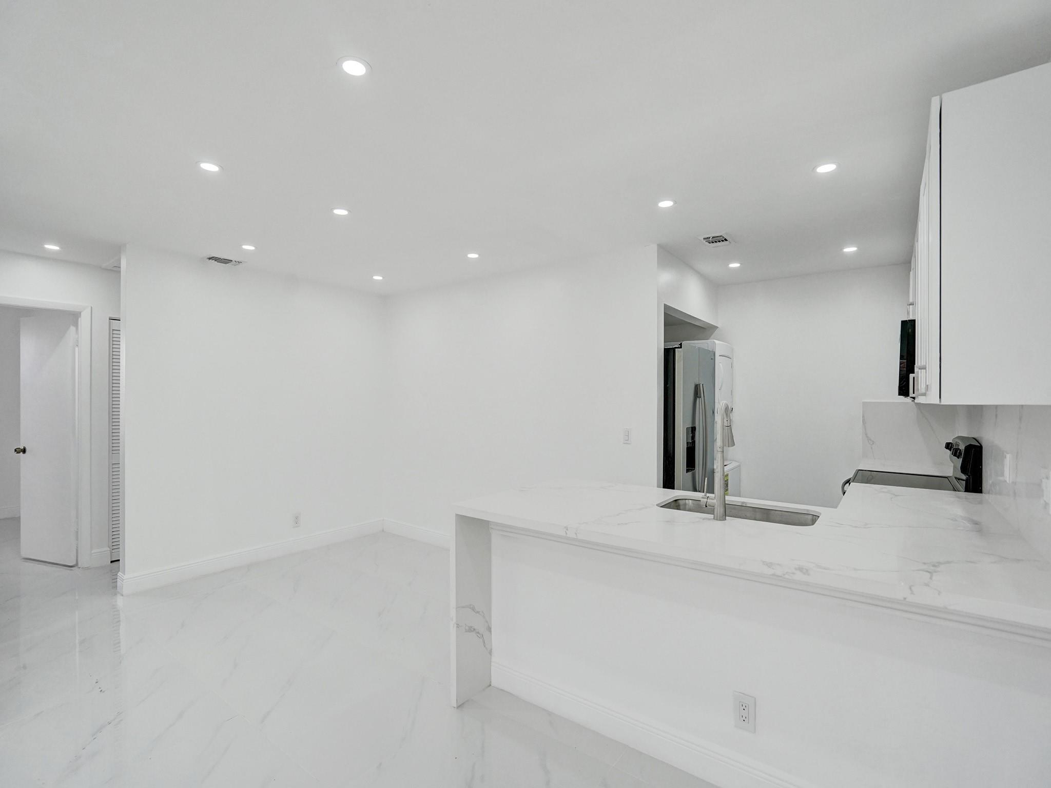 This fully renovated condo delivers today’s sleek design and smart functionality for a lifestyle that’s both stylish and effortless. The open-concept kitchen is a true showpiece, featuring high-end stainless appliances, quartz counters, and custom storage solutions. Spa-inspired bathrooms showcase designer tile, LED backlit mirrors, and modern floating vanities, creating a daily retreat. Community perks include a resort-style pool, tennis courts, and abundant guest parking. Prime location close to major highways, Sawgrass Mills, Amerant Bank Arena, fitness centers, restaurants, and shopping. HOA requires 650+ credit.