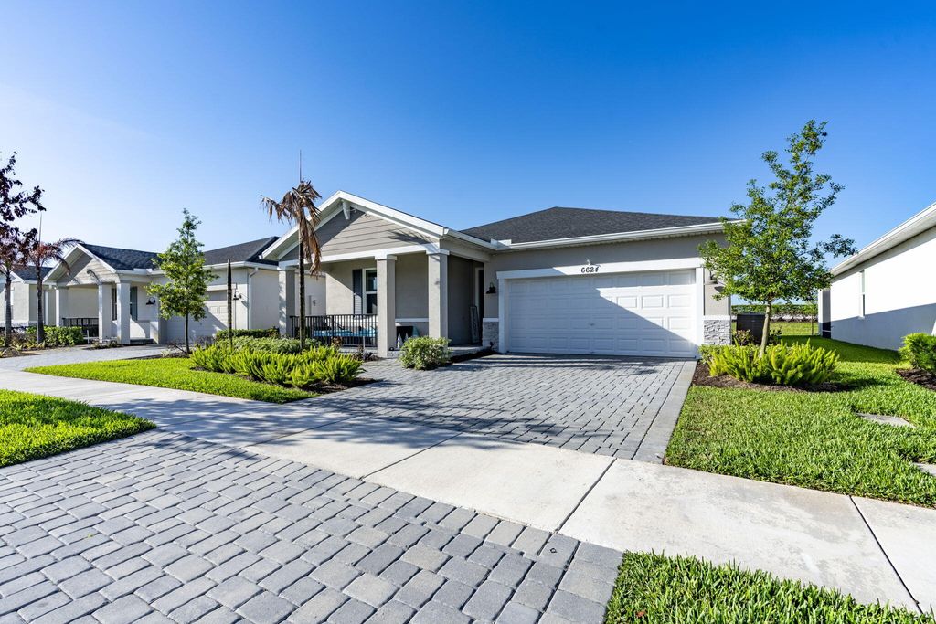 Photo of 6624 NW Cloverdale Avenue, Port Saint Lucie, FL 34987 (MLS # B26012449)