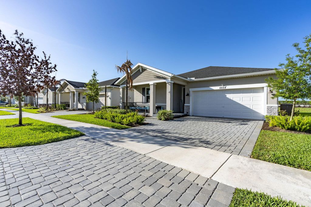 Photo of 6624 NW Cloverdale Avenue, Port Saint Lucie, FL 34987 (MLS # B26012449)