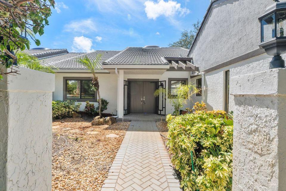 Priced to Sell! Don't miss this incredible opportunity to own in the highly sought-after Hunter's Run Country Club. This spacious home at 4 Clubhouse Lane offers endless potential and is ready for you to bring your personal vision to life. Enjoy peace of mind with a brand-new roof and take in the serene lake views.The bright, open floor plan allows for easy customization, making it the perfect canvas for your dream home. Located just steps from world-class golf, tennis, pickleball, dining, and social amenities, this property combines comfort with the coveted South Florida country club lifestyle.