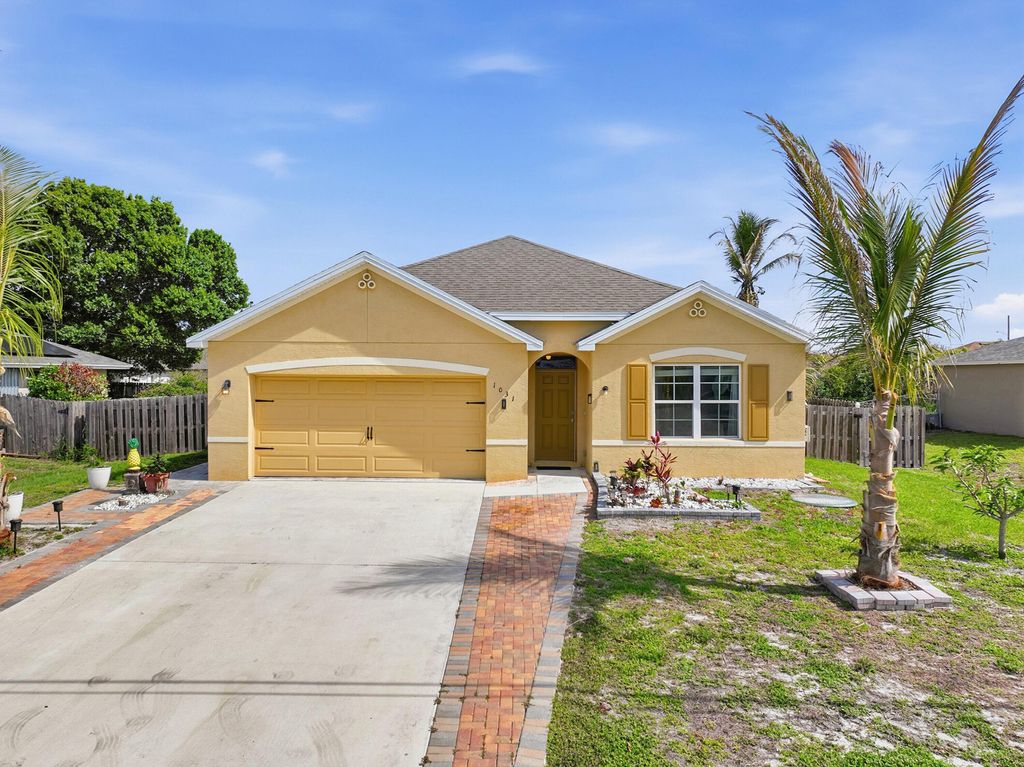 Photo of 1031 SW Alexandria Avenue, Port Saint Lucie, FL 34953 (MLS # B26018615)