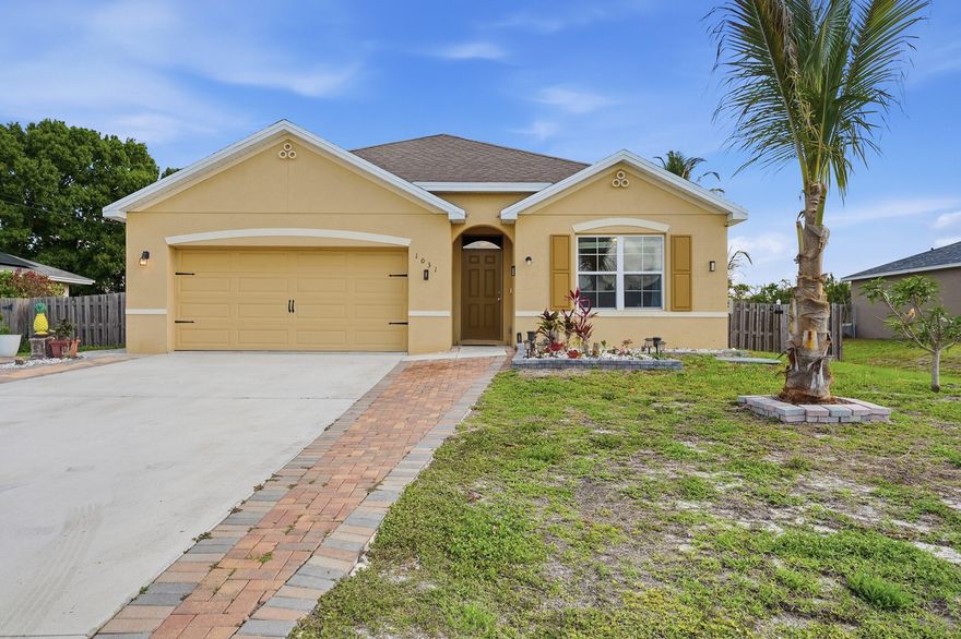Built in 2019, this 1,827 sq. ft. home is located in the fast-growing city of Port St. Lucie and offers modern living with no HOA restrictions; giving you more house for your money. Enjoy an open-concept kitchen that flows into the main living area, perfect for entertaining. Tile floors throughout add durability and style. The home features 2 master bedrooms plus 2  bedrooms and 3 full bathrooms, with walk-in closet for great storage. A 2-car garage plus long driveway provides ample parking. Outside, a large fenced backyard is ideal for pets, gatherings, and outdoor living. Conveniently close to everything you need, this home delivers space, value, and lifestyle. It truly checks all the boxes; what else do you need?