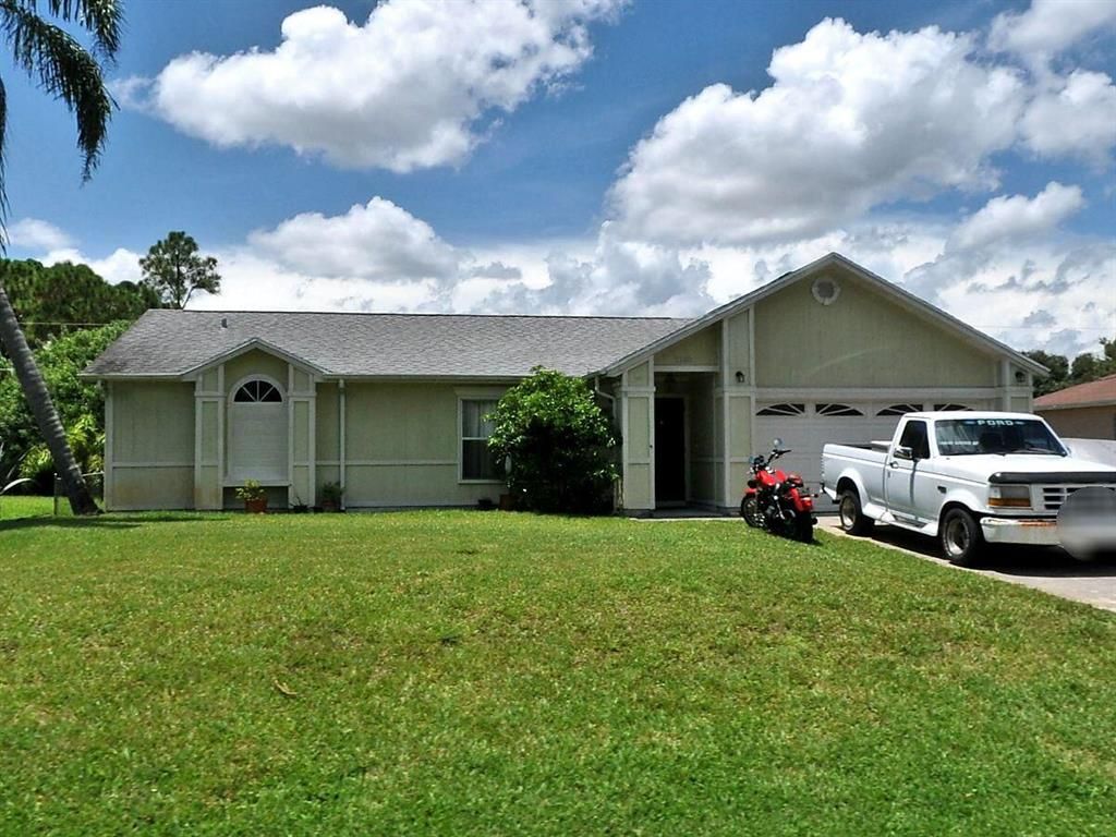 Photo of 1180 SW Irving Street, Fort Pierce, FL 34983 (MLS # R10723218)