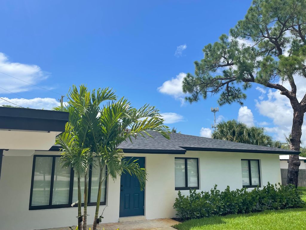 Photo of 544 Flagler Boulevard Blvd, Lake Park, FL 33403 (MLS # R10814833)