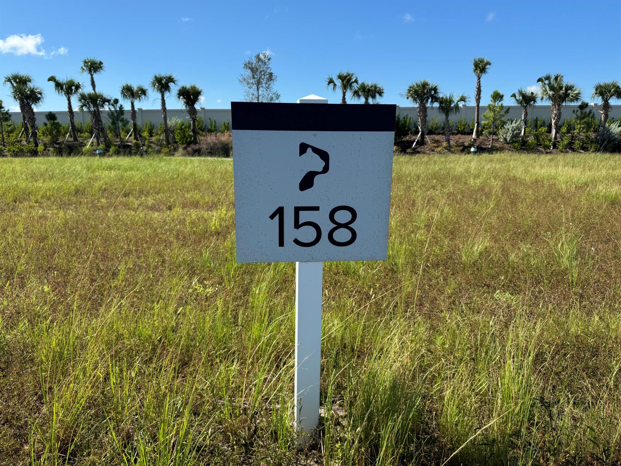 Surrounded by a 2,400-acre nature preserve, this stunning third-acre custom homesite offers unparalleled privacy and breathtaking views. Set within the exclusive Panther National Golf Club--home to Florida's recently rated #1 residential golf course--this property presents a rare opportunity to custom design and build your dream home in one of the most extraordinary settings.  Experience the ultimate in luxury living at Panther National Golf Club.