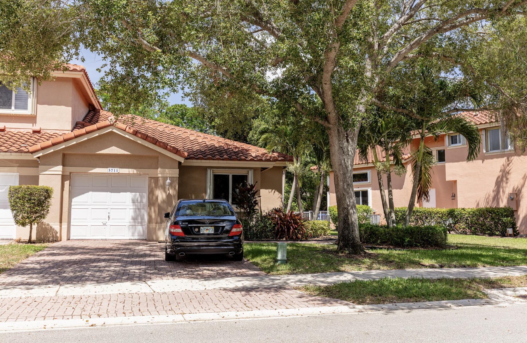 Don't miss this incredible opportunity to own a beautifully updated townhome in the highly sought-after Fairways community of Heron Bay!This 3-bedroom, 2-bathroom home features a new roof, fresh interior paint, and wood-look tile flooring in all bedrooms. The kitchen, living room, and bathrooms all boast brand-new tile flooring, giving the home a modern, cohesive look. Both bathrooms have been tastefully renovated with new cabinets, sinks, faucets, mirrors, and lighting fixtures. The spacious primary bathroom includes a beautifully updated walk-in shower. Additional upgrades include newer appliances, washer and dryer, water heater, and A/C unit. The garage features a brand-new epoxy floor, adding durability and style.Nearby several A-rated Florida schools.