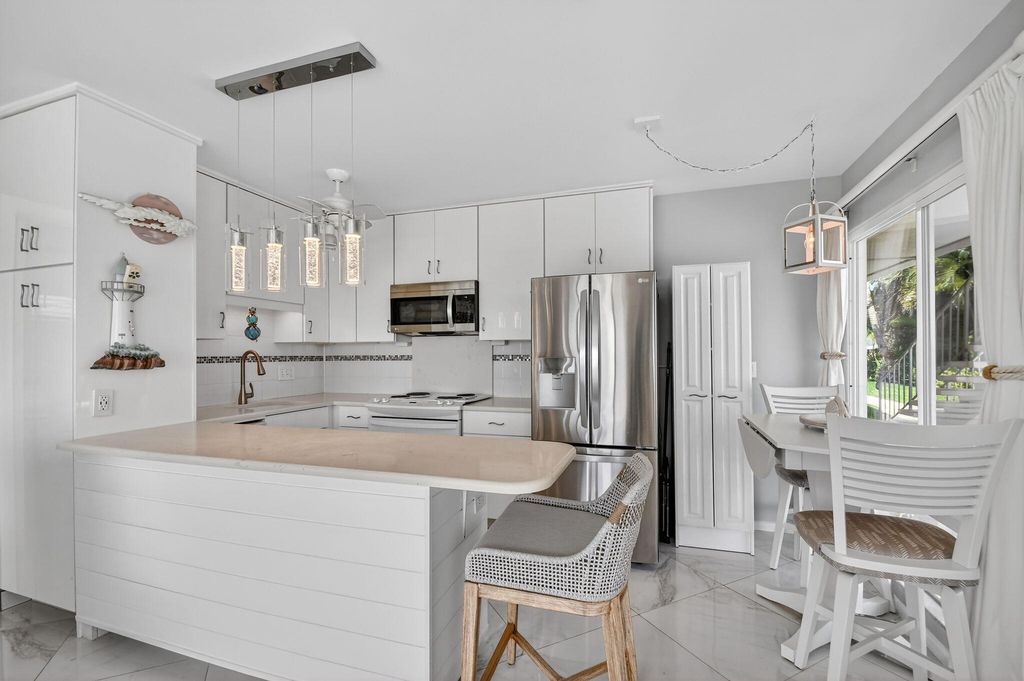 Photo of 214 Inlet Way #106, Palm Beach Shores, FL 33404 (MLS # B26007447)