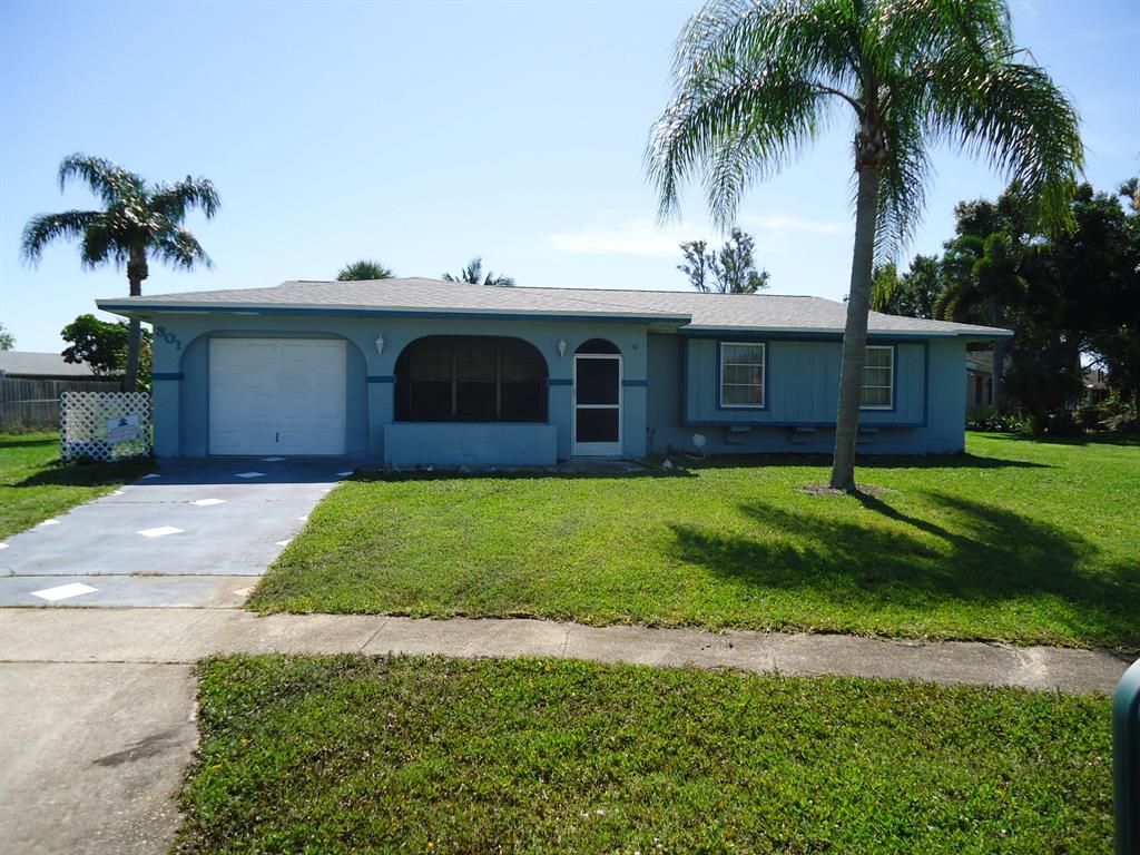 Photo of 301 NE Surrey Street, Port St Lucie, FL 34983 (MLS # R10886337)