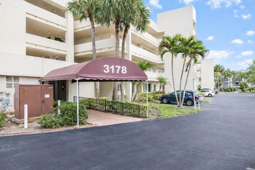Photo of 3178 Via Poinciana Dr #305, Lake Worth, FL 33467 (MLS # R11165581)