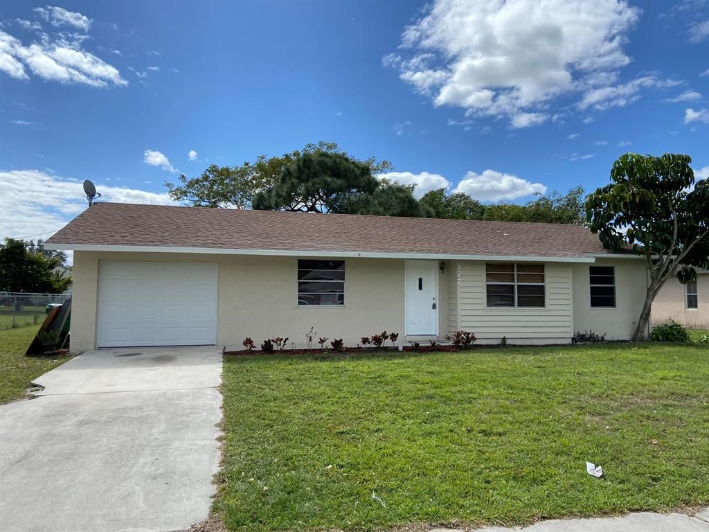 Photo of 522 NW Marion Avenue, Port Saint Lucie, FL 34983 (MLS # R10698347)