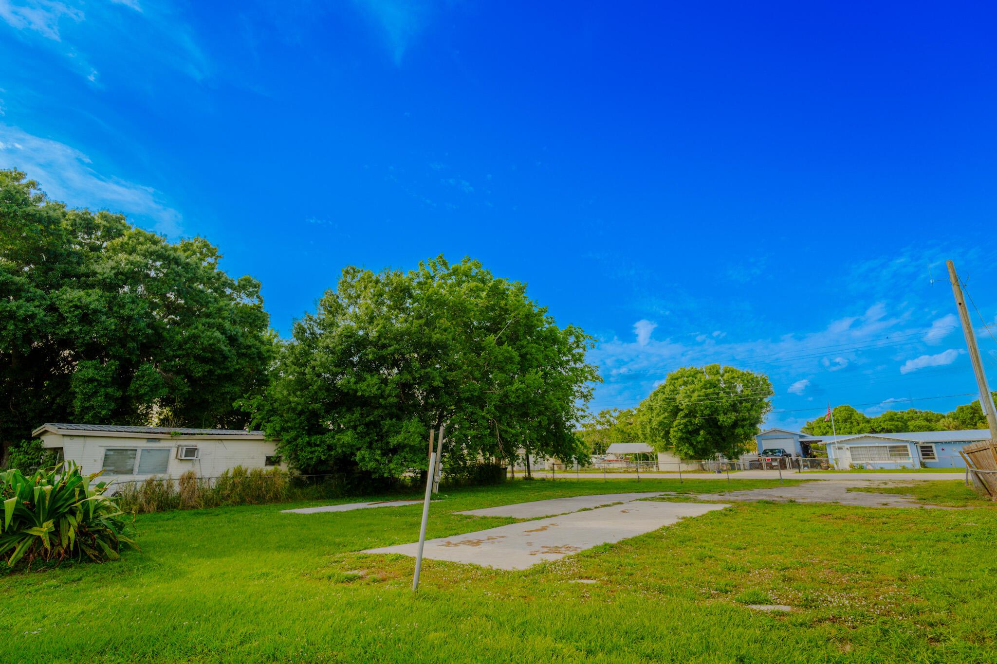 A cleared waterfront lot with direct access to the Great Lake of Okeechobee. This lot allows for a mobile home or a single family home - your choice. This is not a facade it comes with a seawall a dock and a boat lift! Thrive and live your life surrounded by sports fishing, and Florida sunsets, building your home here puts you 40 miles from the Atlantic coast. Take a minute to breathe it all in! The lot is prepped and perfect for any boating enthusiast who wants peace and tranquility. Lets make a deal.