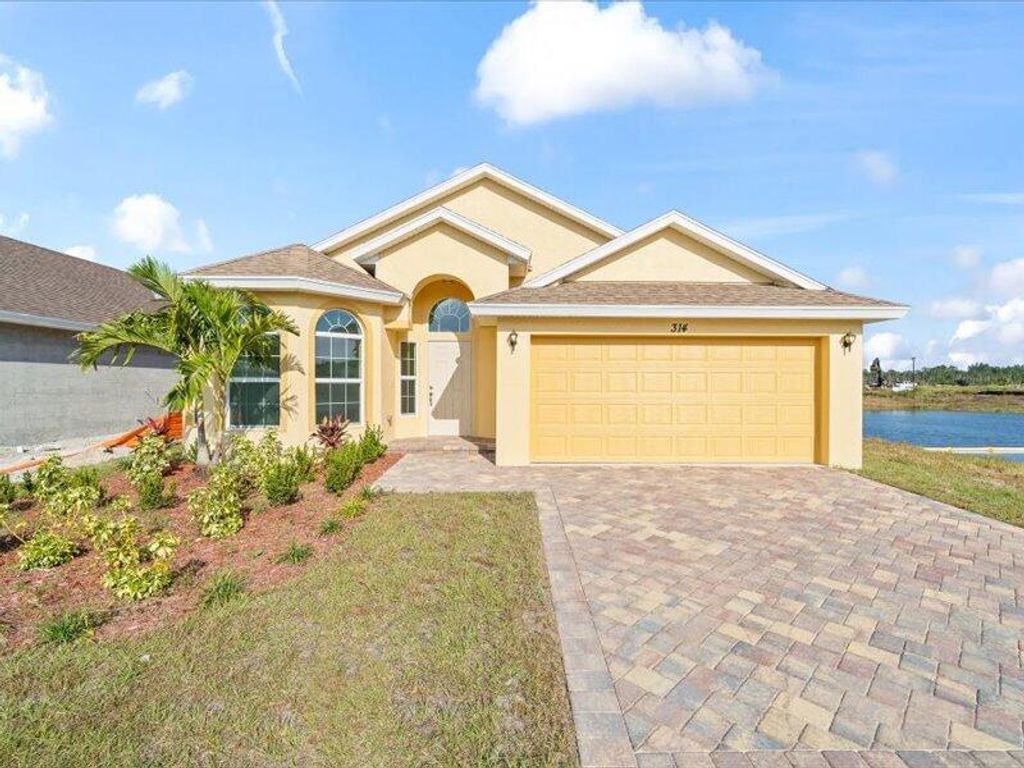 Photo of 314 Silver Sands Lane, Fort Pierce, FL 34945 (MLS # R11146119)