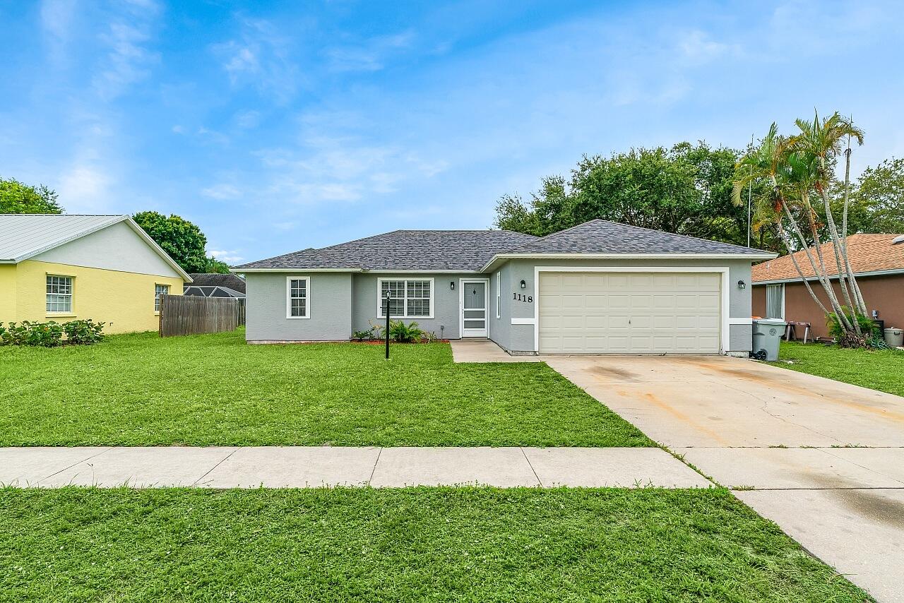 Prime Vero Beach location close to shopping, dining & the beach. NO HOA! This beautifully remodeled 3 bedroom, 2 bathroom home features a modern kitchen with bar top seating, quartz counters, upgraded cabinets, custom backsplash & stainless steel appliances. Freshly painted inside & out with new flooring throughout, new baseboards, LED lighting, stylish fixtures & fans in every room. Enjoy updated bathrooms with stylish finishes + stay cool in the spacious screened patio with fan. This home is complete with a New roof (2025), New AC (2025) & water heater (2023). 9 minutes or less to the beach!