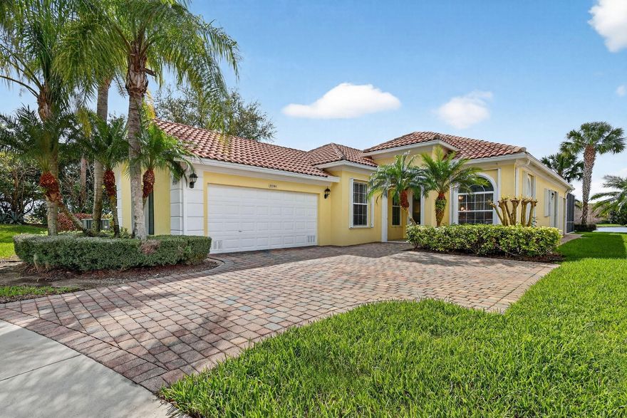 Immaculate 3-bedroom + office pool home in the heart of Tradition, set on a private lakefront cul-de-sac lot. This lovingly maintained residence offers serene water views and exceptional privacy. Enjoy a heated, screened-in pool ideal for relaxing or entertaining. Features include a glass entry door, accordion shutters, paver brick driveway and walkway, and solid poured concrete construction. Major updates include a 2017 A/C and 2022 water heater. The roof has been inspected and certified by a licensed roofer to be leak-free with over 7 years of useful life remaining. Freshly painted exterior. Located in a gated community with 24-hour manned security and resort-style amenities, including two heated pools, tennis, pickleball, basketball, bocce, fitness center, clubhouse, and playground. HOA covers cable, internet, alarm monitoring, lawn care, exterior painting, and security. Furniture negotiable. Clean, well-maintained, and priced to sell—this exceptional home will not last!