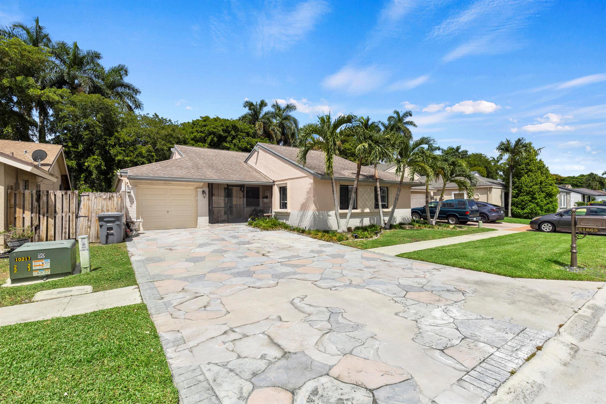 Looking for comfort, character, and a splash of fun? This charming 3-bedroom, 2-bath single-story ranch features vaulted ceilings, an updated kitchen, and a screened-in pool. The 2019 roof and low HOA make it a low-maintenance choice with big benefits.The location is convenient to highly rated schools, major roadways, shopping, and dining. South County Regional Park is just minutes away, offering walking trails, sports fields, a water park, and a dog park. Whether you enjoy relaxing poolside or exploring the area's amenities, this home offers easy Florida living without the extra fuss.
