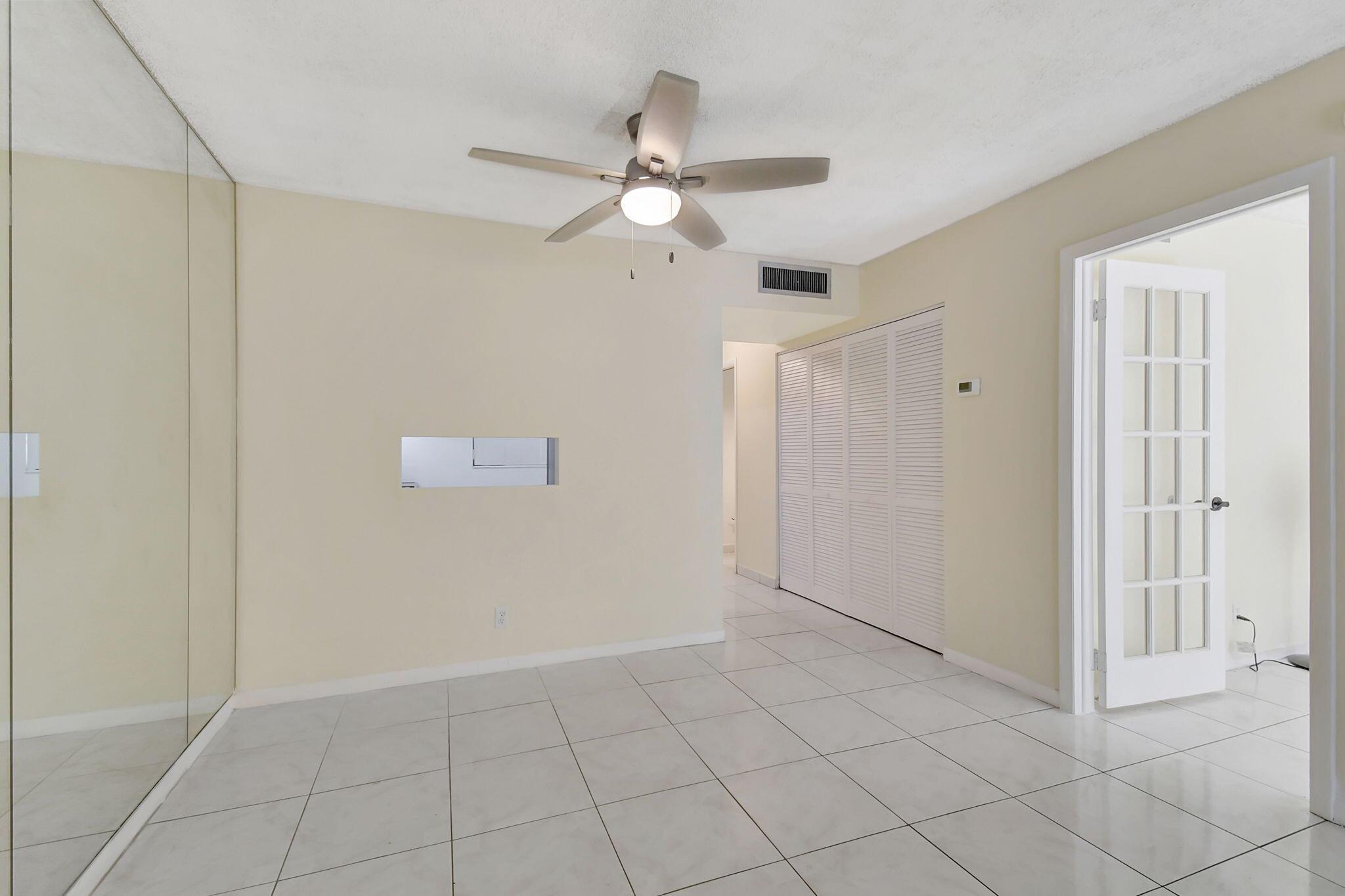 Welcome home! This move-in ready 1 bedroom, 1.5 bath condo is tucked inside a beautifully maintained 55+ community and has all the charm and functionality you've been looking for. Step into a bright and welcoming first-floor unit with easy-care tile floors throughout, a practical kitchen with warm wood cabinetry and newer appliances, and roomy closets that keep everything tidy. The French door entry into the primary bedroom adds a touch of West Coast flair--clean, airy, and effortlessly stylish. The primary bathroom features a refinished combo tub and shower for a fresh, clean look. The enclosed Florida room--with brand new blinds--offers extra space to relax, read, or entertain. Plus, you're just steps from the laundry room for everyday convenience. Newer AC, too!