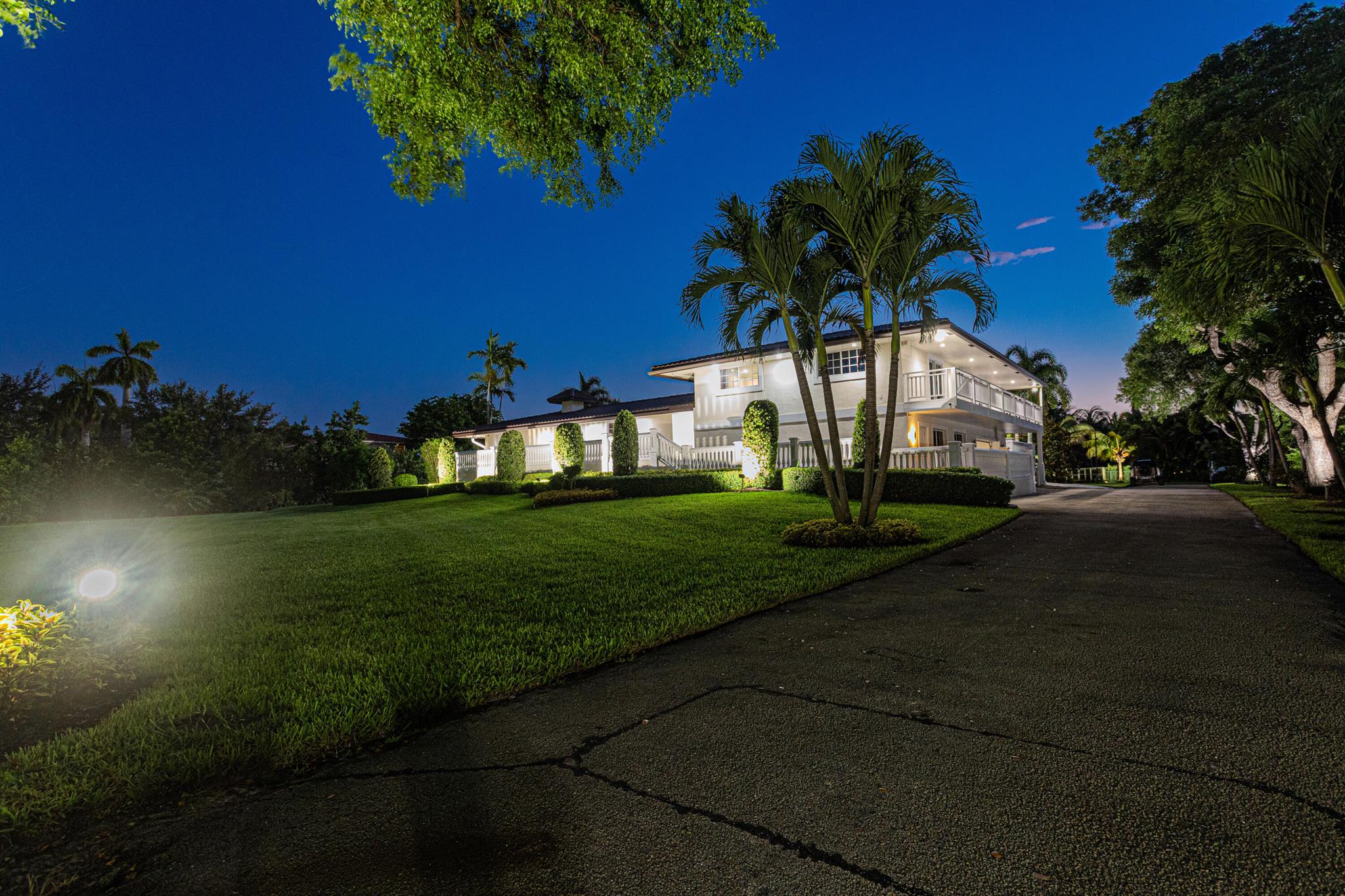 A Slice of Paradise in Prestigious Plantation Acres. Tucked away in a private cul-de-sac within the coveted Horse Country of Plantation Acres, this sprawling 1.39-acre estate is where timeless Southern charm meets modern sophistication. Enclosed by a gated entry and framed by lush palms, exotic fruit trees, and vibrant landscaping, this architectural gem redefines estate living with elegance and style. Step inside this multi-level masterpiece boasting 5 bedrooms, 4 bathrooms, Home Theater, Exercise room and a Basement almost doubling your living space and inviting endless possibilities for a wine cellar, game room, or private studio. In addition, a half basketball court, heated pool with a spacious deck, & wrapped around balconies.