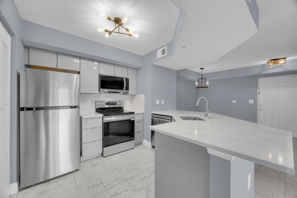 Photo of 3809 NW Mediterranean Ln #104, Jensen Beach, FL 34957 (MLS # F10536805)