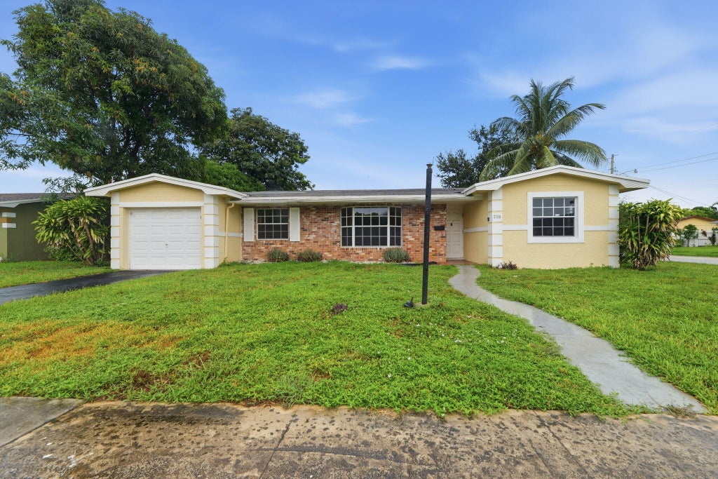 Photo of 2700 NW 36th Avenue, Lauderdale Lakes, FL 33311 (MLS # B26072048)