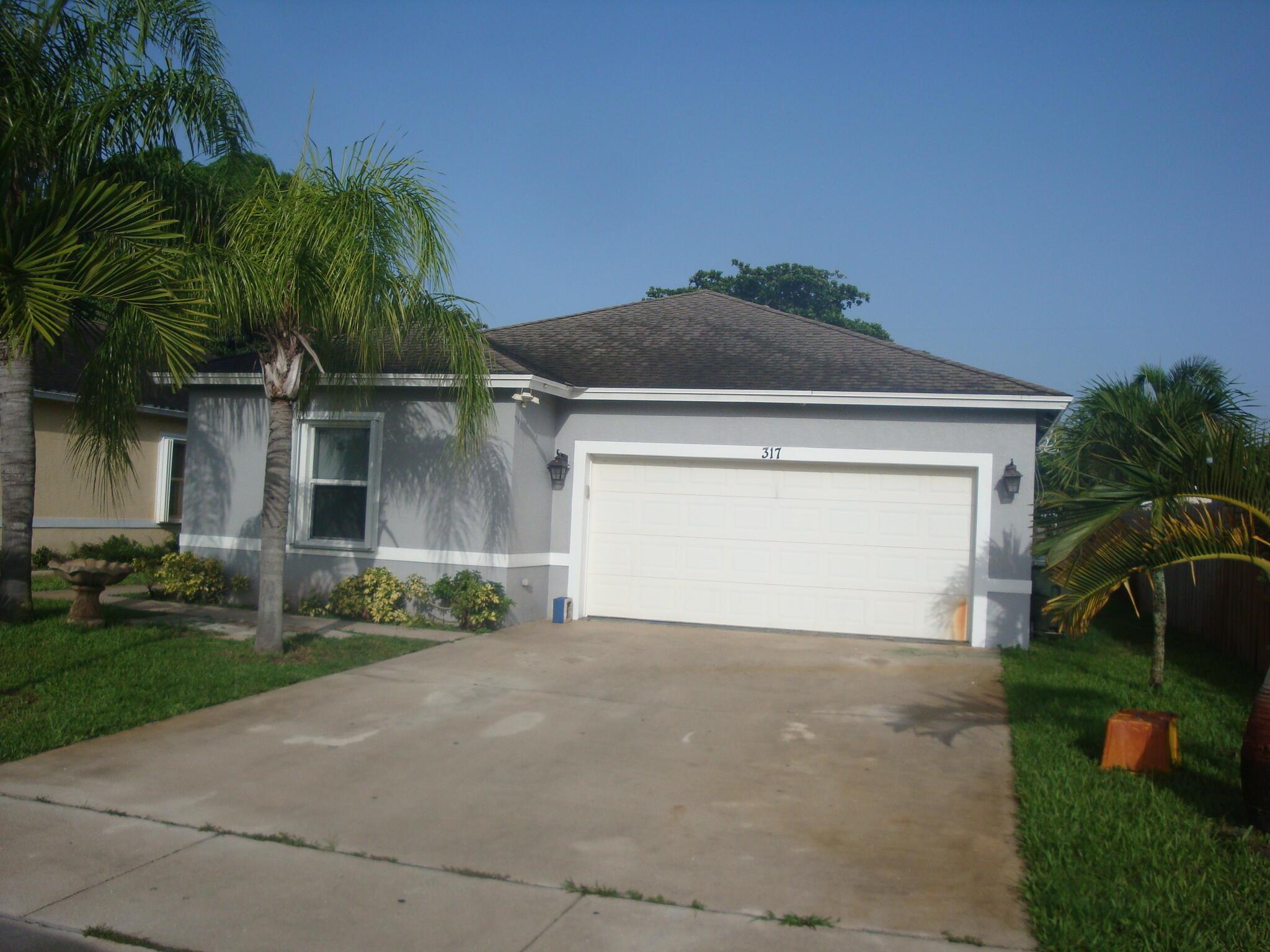 BEAUTIFUL TOTALLY RENOVATED 4/2 and 2 car GARAGE. NEW WOOD KITCHEN WITH GRANITE COUNTER TOPS AND REMODELED BATHROOMS, ALL TILED FLOORS. GREAT LOCATION,! HURRY WONT LAST!