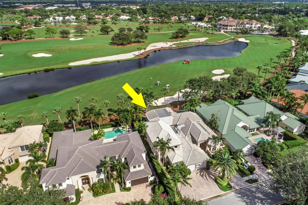 Beautiful 7 bedroom 6 1/2 bathroom estate home on the 18th fairway of the golf course with extraordinary views of the stunning new clubhouse and lake. The light and bright Main House has 4 bedrooms, 4 1/2 bathrooms with volume ceilings in the living room and dining room. The kitchen is ideal for entertaining featuring a large island, gas range and wine refrigerator. Work from your home office with unobstructed views of the golf course. The attached Guest House with private entrance has 3 bedrooms, 2 bathrooms and its own kitchen and living area. This custom floorplan is ideal for live in staff, in law suite, nanny suite or guests. Located in one of the area's most prestigious Jack Nicklaus Signature designed golf course communities. $15M club renovation in top 100 Platinum Clubs of the w