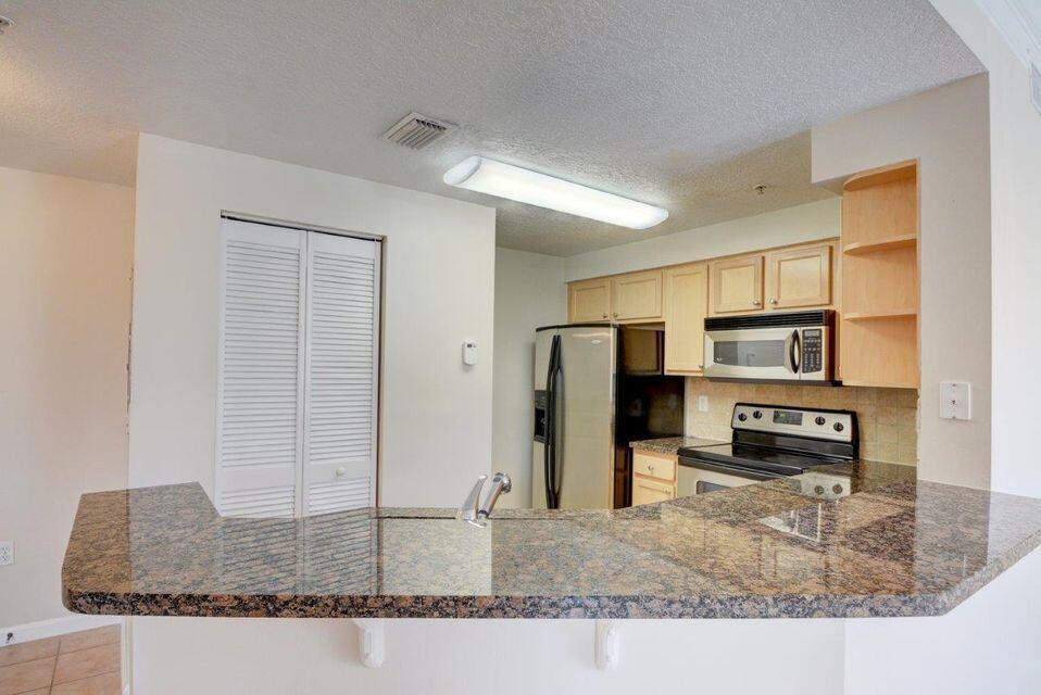 SOMERSET AT ABACOA CONDO - Residential