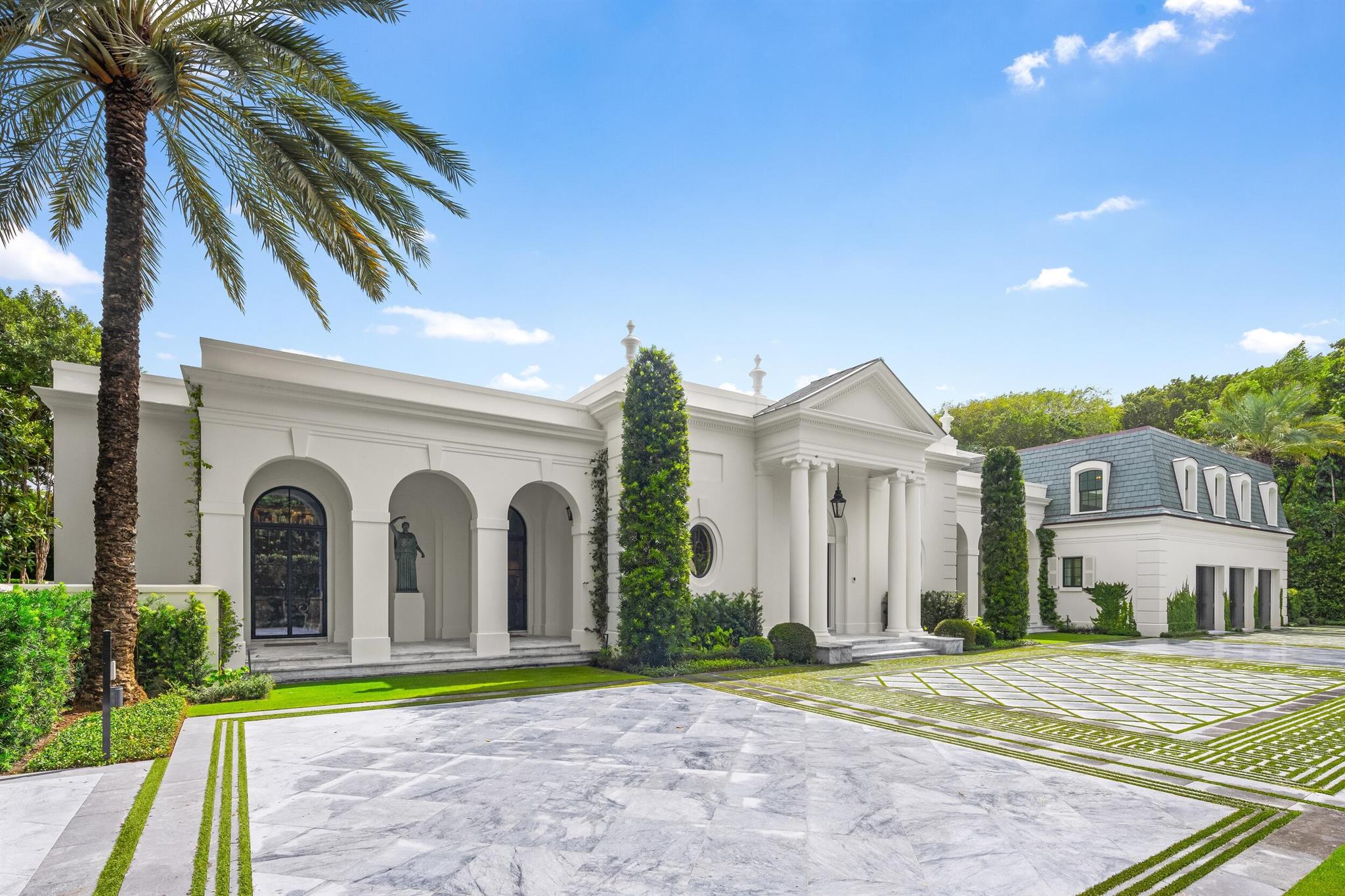 Encompassing almost an acre of prime Palm Beach real estate on Billionaires Row, 1230 S Ocean Blvd. is truly a one-of-a-kind estate. Completely reimagined by renowned builder Greg Giuliano and interior designer Miles Redd, this home offers unparalleled luxury and craftsmanship. Every detail has been meticulously curated, ensuring the highest level of quality throughout the property.As you step inside, you'll notice the finest finishes and fixtures curated from around the world. From marble and wood flooring to a state-of-the-art kitchen featuring Miele, SubZero, and Wolf appliances, topped off with a stunning La Cornue 6-burner gas stove and a wine fridge. Every room is thoughtfully designed, with a Lutron lighting system and pre-wired audio/visual equipment enhancing the home's