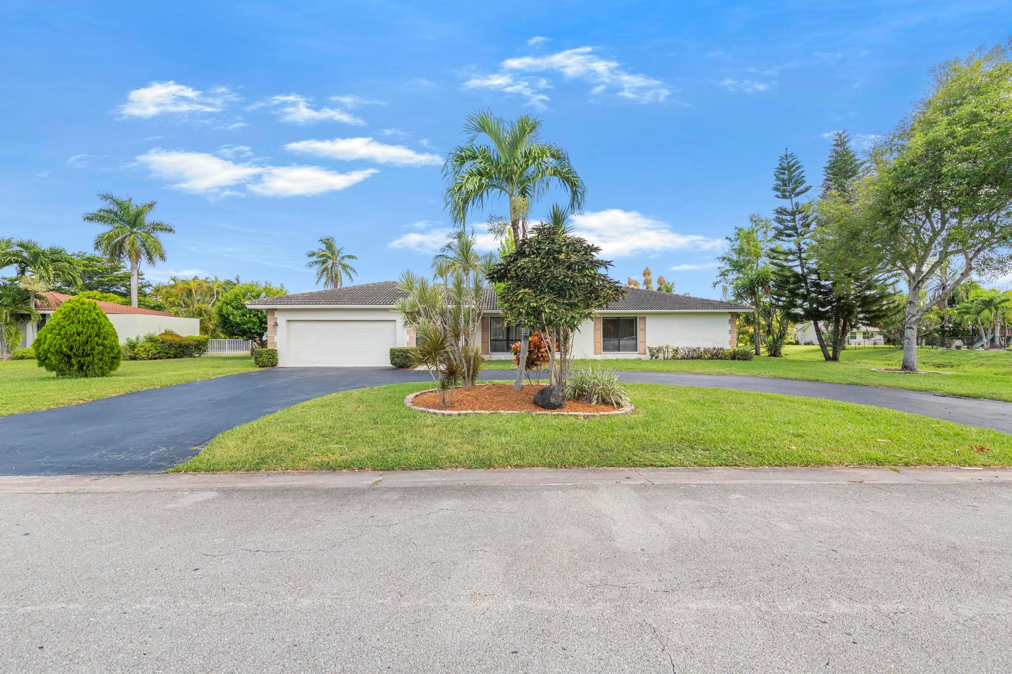 One of the areas most sought-after communities, this home is part of a beautifully maintained neighborhood. This home features four generously sized bedrooms offering plenty of storage space. The master suite offers a massive walk in closet and serene views of the pool and tranquil waterfront. The home is designed for functionality and style. Theres ample living space ideal for entertaining or simple day to day life. The circular driveway adds elegance and convenience, along with a 2 car garage, welcoming you home in style. Come visit today.