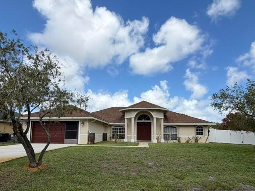 Photo of 5878 NW Carovel Avenue, Port Saint Lucie, FL 34986 (MLS # R11169706)