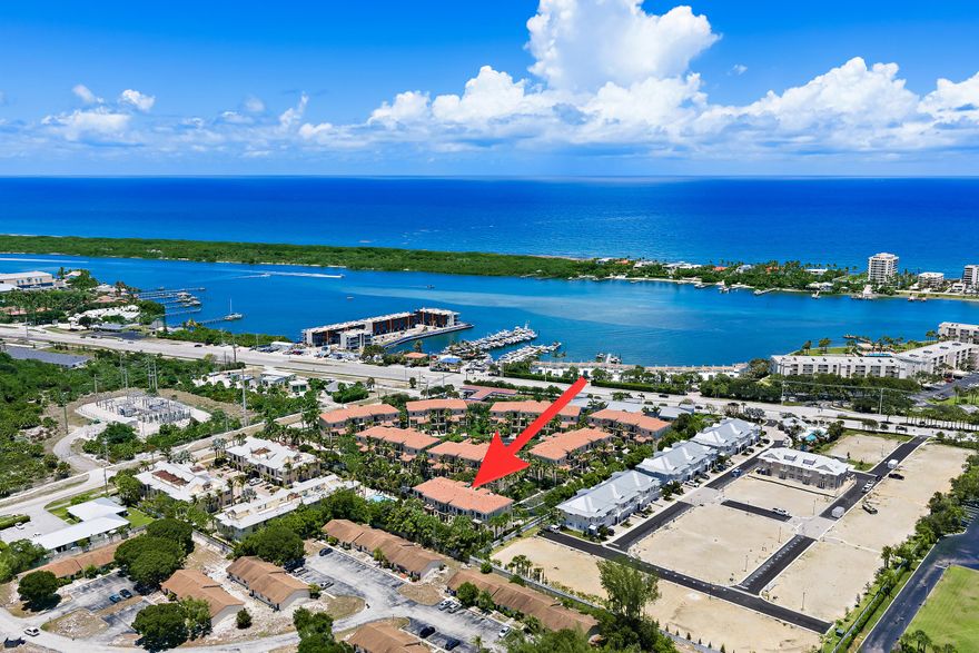 Tucked within a small, gated community in the heart of Tequesta, this impeccably maintained three-story luxury townhome offers just under 2,900 square feet of thoughtfully designed living space, complete with a private elevator for effortless access to all levels—perfect for those who want the space of a multi-story home without the inconvenience of stairs.  As an end unit, the home is filled with natural light and features soaring 11-foot ceilings and an open-concept layout that creates a spacious  feel from the moment you arrive. Since purchasing the home, the owner has completed an extensive list of meaningful upgrades, including a 2026 A.O. Smith hot water heater, 2025 HVAC system, new LG refrigerator and dishwasher, Newair 15-inch built-in wine refrigerator, new thermostat,  updated kitchen sink and faucet,  and all new door hardware throughout.  The entire interior has been freshly painted, including the walls, ceilings, casings, baseboards, garage, and exterior garage door, while oversized 60x30 porcelain tile flooring was installed on the second floor and the stair carpeting was replaced for a cleaner, more modern look. An additional custom storage closet was also added in the garage—an upgrade unique to this property.  Beyond the cosmetic improvements, the home has been thoughtfully enhanced with high-quality behind-the-scenes upgrades that elevate both convenience and functionality. A user-friendly smart home system controls LED lighting throughout the residence, offering customizable colors and operation by app or wall switch. The owner also replaced outlets, switches, and GFIs throughout the home, and installed motorized blackout blinds in the primary bedroom for added comfort and privacy.  Designed for both everyday living and entertaining, the main living area opens to a private balcony overlooking a peaceful preserve, while the spacious primary suite enjoys its own balcony retreat.  Residents enjoy a clubhouse, fitness equipment, and community pool, all within this intimate, tight-knit neighborhood located just moments from the turquoise waters of the Intracoastal, waterfront dining, marinas, and everything that makes Tequesta one of South Florida's most sought-after coastal communities.