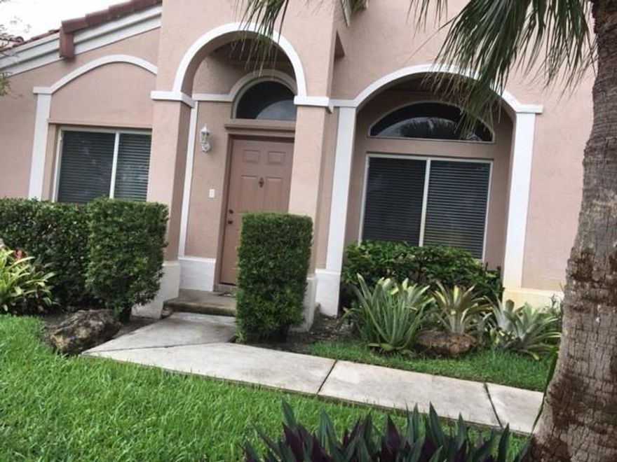 Lovely 3 bedroom two bath detached home , complete with large family room as well as living room, large screen and roofed Lania,  with 2 car garage in Village of Harmony Lakes, tiled and laminate floors thru out home, community pool, tennis courts
