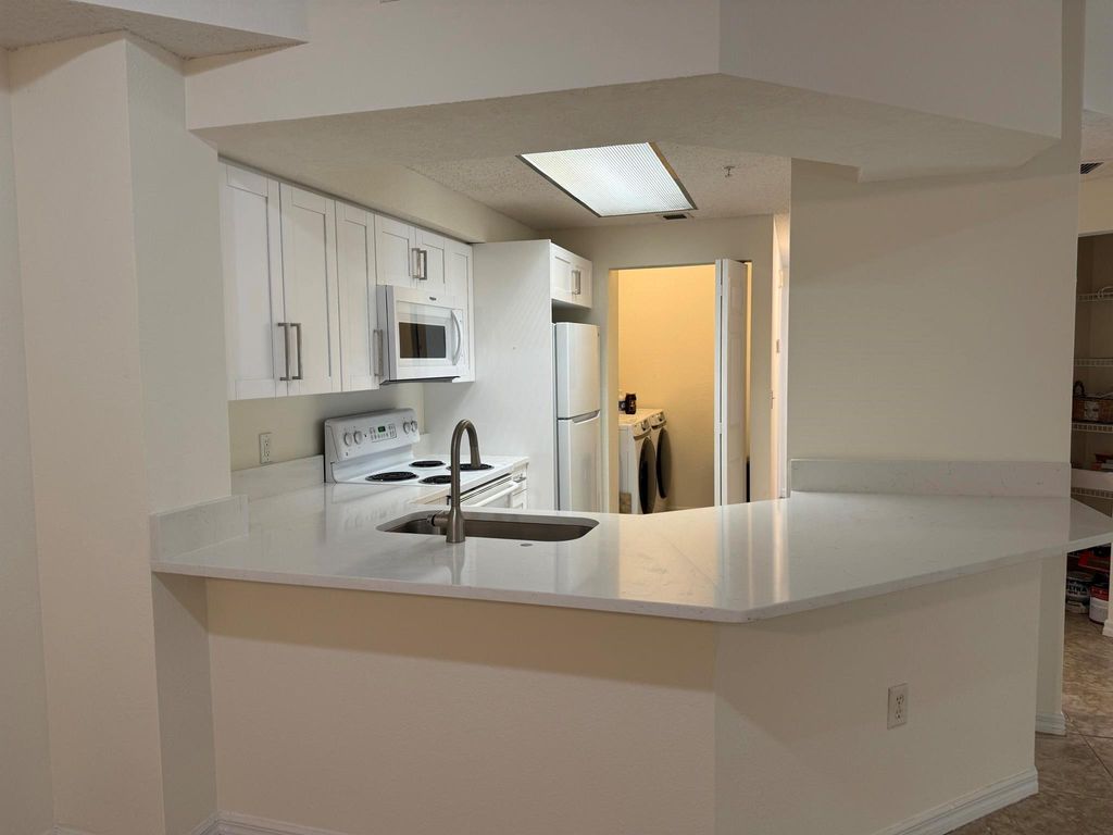 Photo of 3020 Alcazar Place #303, Palm Beach Gardens, FL 33410 (MLS # R11144946)