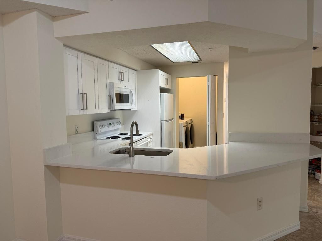 Photo of 3020 Alcazar Place #303, Palm Beach Gardens, FL 33410 (MLS # R11144946)