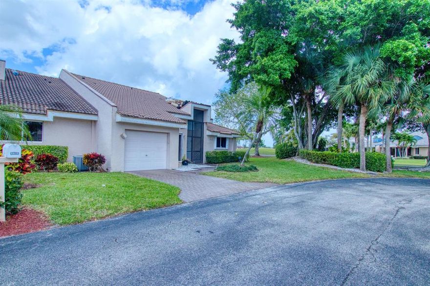 Enjoy the great golf views  from this  2/2.5 convertible corner villa w. 1 car garage & located on  beautiful interior lot.  Unit is coming furnished.  New roofs are currently being replaced  along w. wind impact windows on  sky lights w. no additional assessments.  Unit has  complete set of accordion storm shutters & newer A/C.  Enjoy walk in closets, sit down kitchen, laundry room, bar, roman tub, corian  counter tops, solar shades, lots of storage & fabulous glass enclosed porch w. patio.  Experience the peace & ambiance of manned guard gates & 24 hour security patrols all located on lush tropical grounds.  Tropical community pool just a few steps away.  You are minutes away from Fla. Turnpike, I95, great shopping, restaurants, entertainment, hospitals, airports and of course the beach.