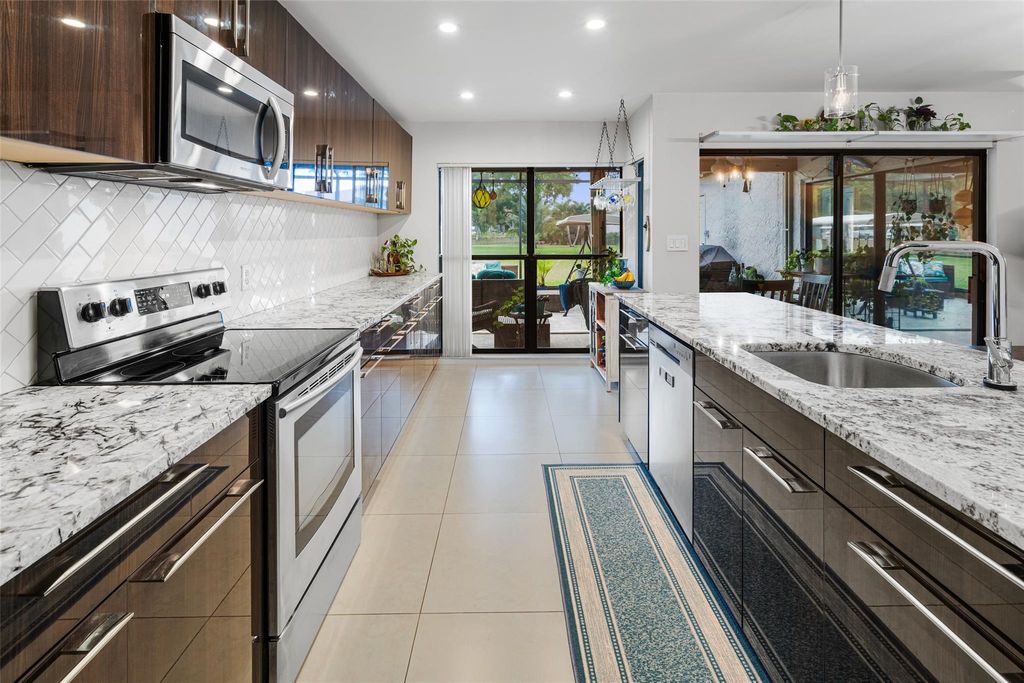 Photo of 3056 Deer Creek Lake Shore Dr #3056, Deerfield Beach, FL 33442 (MLS # F10538913)