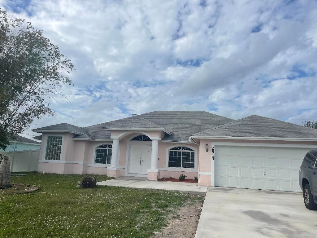 Photo of 2813 SE Melaleuca Boulevard, Port Saint Lucie, FL 34952 (MLS # R10942197)