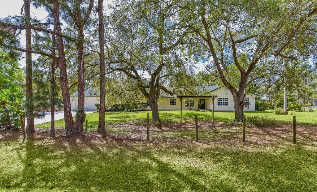 Photo of 16244 E Downers Drive E, The Acreage, FL 33470 (MLS # B26003968)
