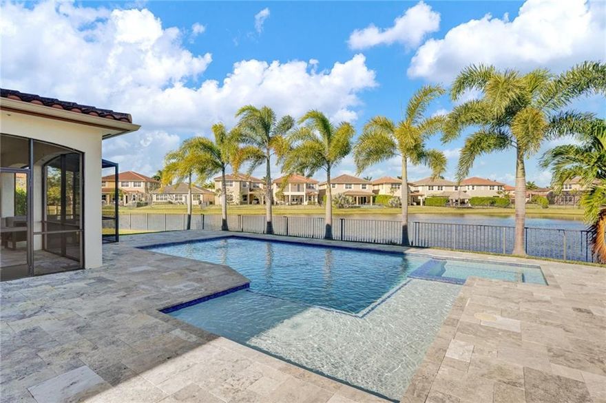 This beautiful lake front home is located on a cul-de-sac in one of Parkland's most desired neighborhoods.  Situated on an oversized lot with expansive lake views, you can enjoy both the sunrise and sunset from the comfort of your own home. The open floor plan features 4 bedrms+ loft+ playrm. Also, you will find a chef's kitchen with cooking island and gas appliances, a formal dining room, bonus playroom and two family rooms. Upstairs has a loft and 4 large sized bedrooms w/custom walk-in closets and master with sitting area. The outdoor space is quiet and spacious with a recently completed modern style swimming pool w/spa that runs on the gas line -so it heats within minutes! Custom screened in patio area, and additional green space throughout. This home is truly one that has it all!