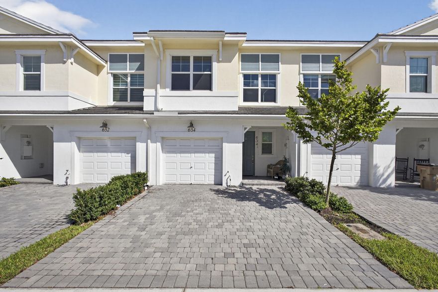 Step into a home defined by refined craftsmanship, impact windows, and thoughtful design in this beautifully appointed 3-bedroom, 2.5-bath townhome located in the gated community of Sandpiper Pointe. Built in 2023 by Toll Brothers, this residence seamlessly blends quality construction with stylish, low-maintenance living.  The bright, open-concept first floor is designed for both effortless entertaining and everyday comfort, featuring a chef-inspired kitchen with an oversized island, stainless steel appliances, quartz countertops, upgraded lighting, and abundant cabinetry. The space flows seamlessly into the expansive great room and casual dining area, finished with large-format tile flooring for a clean, modern aesthetic.  A covered lanai opens to a private backyard perfect for relaxing or hosting.  Upstairs, plush carpeting enhances comfort throughout. A versatile loft offers the ideal flex space for a home office, media room, or play area. Generously sized secondary bedrooms include ample closet space and share a well-appointed full bath. The spacious primary suite is a true retreat, complete with a large walk-in closet and a spa-inspired bath designed for both comfort and ease. A second-floor laundry room adds everyday convenience. Residents enjoy resort-style amenities including a pool, fitness center, and playground, all just minutes from the Tri-Rail station, major highways, shopping, dining, and nearby universities. A standout opportunity to experience elevated townhome living in one of Deerfield Beach's most desirable gated communities. Schedule your private showing today and experience the lifestyle Sandpiper Pointe has to offer.