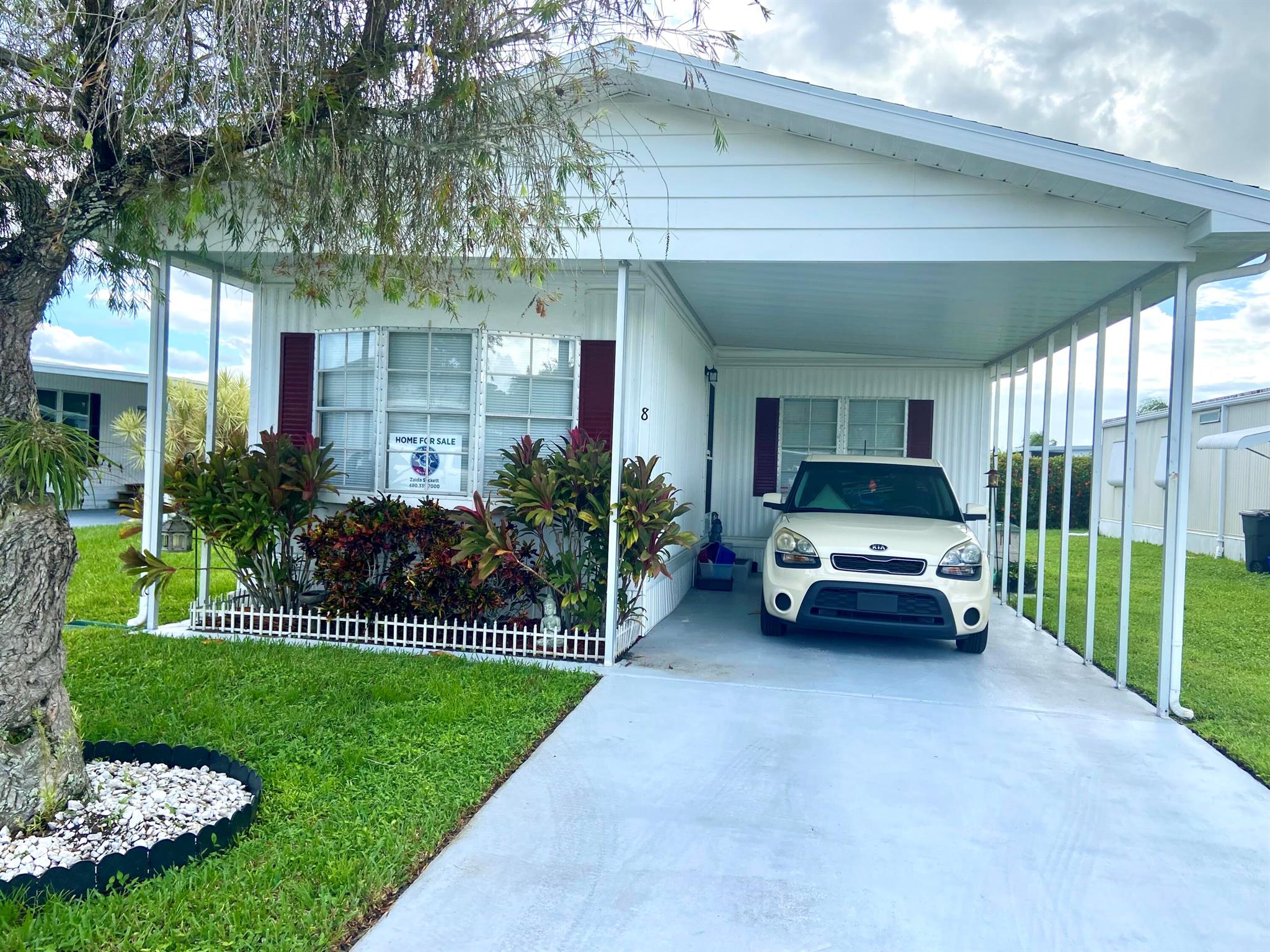 Welcome to 8 Florencia Lane in Port Saint Lucie Fl. This 2 bed/2 bath home is located in a great 55+ community on leased land 833.06 a month, with some great amenities, lawn care, trash and recycle, clubhouse activities galore and use of the boat launch in the community, not to mention tennis, golf, and an array of events! Offered partially furnished AS_IS AS SHOWN with a lovely master suite, a den area, and indoor laundry. This split layout offers privacy for you and guests with a separate bath/tub combination. Central air replaced 2022, shingled roof 2013, circuit breaker and ceiling fan and fixtures newer and washer replaced 2022. Carpet should be the concern for replacement as the current owner opts to allow the new owner to decide. Call ME today and make this your home sweet home!